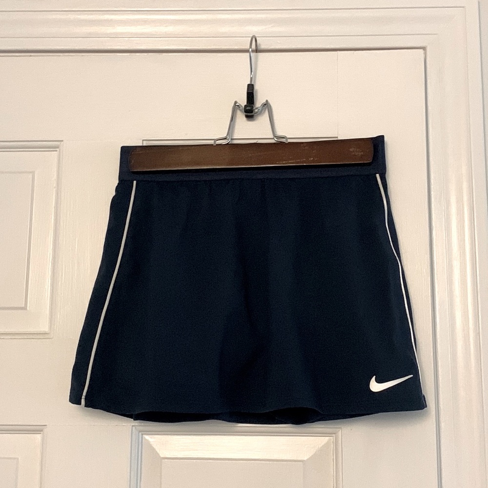 This is a navy tennis skirt with white piping.